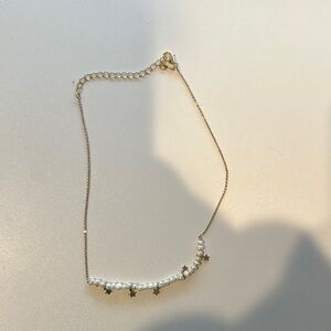 Elegant Gold and Pearl Star Necklace